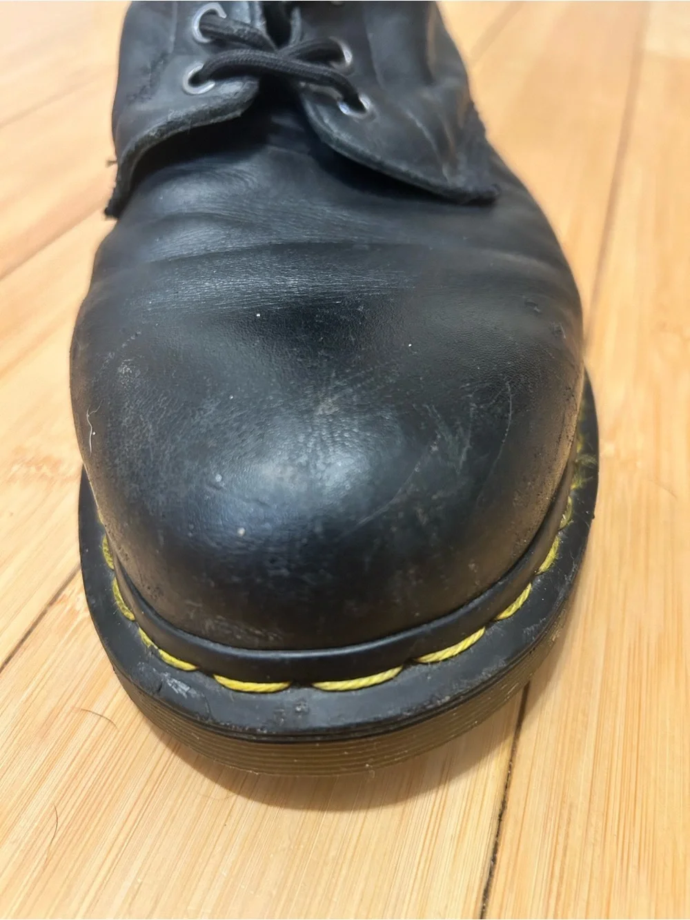Dr. Martens Black Leather 8-Eye Lace-Up Boots with Yellow Stitching